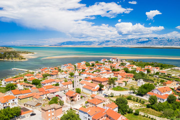 Naklejka na ściany i meble Aerial view of town of Nin with seascape and Velebit mountain in background, Dalmatia, Croatia