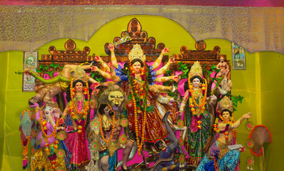 Durga Puja or Durgotsava,is an annual Hindu festival celebrated mainly in West Bengal,Indian.Durga is Goddess riding a lion with many arms each carrying weapon and defeating evil power of Mahishasura.