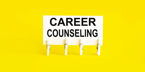 CAREER COUNSELING , written on white sticky note on yellow background