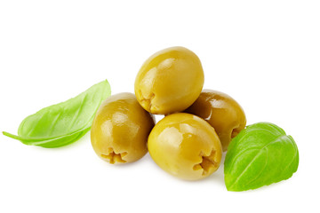 green marinated olives with basil leaves isolated on white background