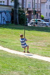 Happy kid on zip line in the city of Essen - Germany
