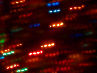 Obraz premium Blurred colored holiday lights as background.