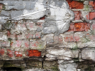 Part of an ancient weathered grunge brick wall as background.