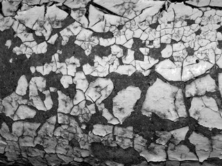 Monochrome abstract background with cracks.