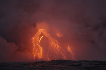 Lava flowing into the ocean from lava volcanic eruption on Big Island Hawaii, USA.