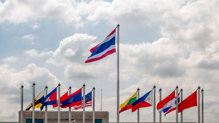 Flags of Asian states fly near the Royal Thai Mint building in Bangkok, Thailand