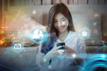 Beautiful girl futuristic internet social media concept, using mobile phone device interacting...