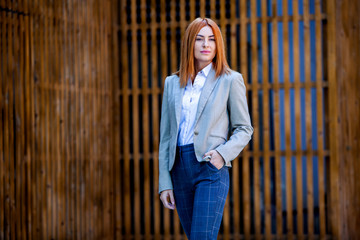 Confident business expert. Happy successful professional posing near office building. European girl. Russian business lady. Female business leader concept. Portrait Of Successful Business Woman