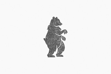 Black silhouette wild bear standing as emblem of nature exploration hand drawn stamp effect vector illustration.