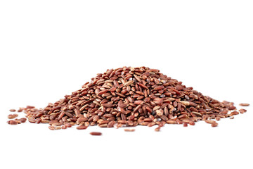 Heap of uncooked wild brown rice on a white background. Red grains, organic natural healthy food side view, isolated. Ingredient for traditional Asian cuisine.