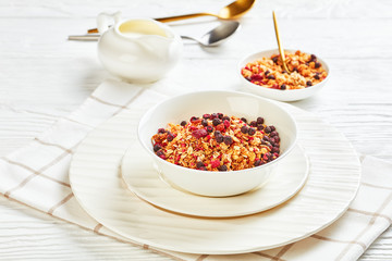 Bowl with granola on a wooden table