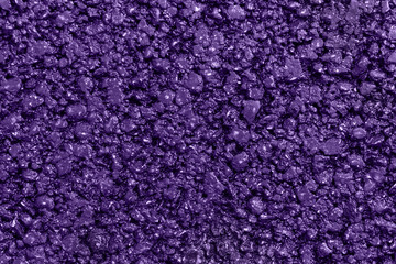 New violet asphalt. Textured, background. Flat lay. Close up