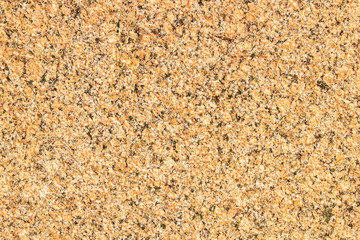 The surface of a polished granite slab with a variegated texture.