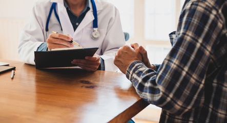 The patient listens to the medical examination results from the doctor. Concept of health...