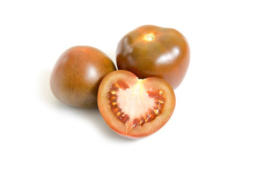 Dark red fresh tomatoes whole and slices isolated on white background.