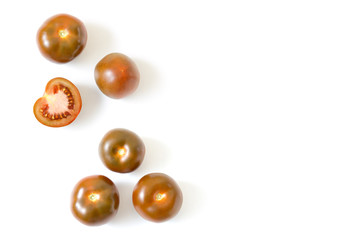 Brown red fresh tomato whole and slices isolated on white background.