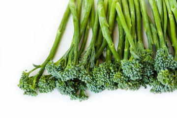 Fresh broccolini isolated on white background with copy space.
