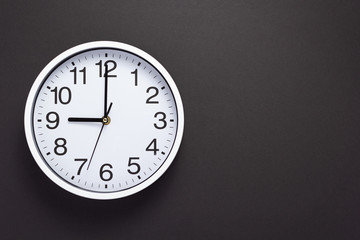 clock and shelf at wall background