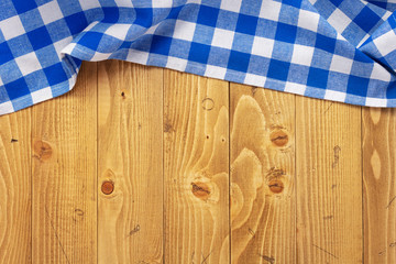 cloth napkin at old wooden board table background