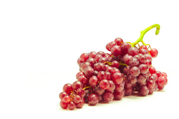 Seedless red grapes isolate on white background.