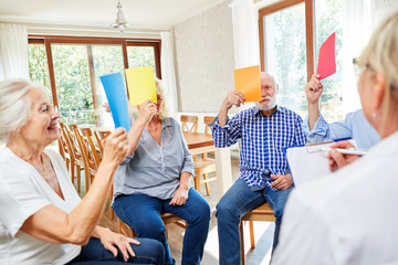 Seniors at group therapy session with psychotherapist