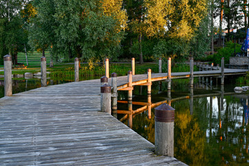 wooden bridge over water in beautiful park
