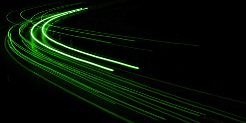 abstract green car lights at night