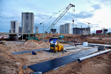 Сonstruction of underground pedestrian crossing. Foot tunnel and underground passage building. Painting bitumen at concrete. Cold and hot fluid-applied waterproofing. 