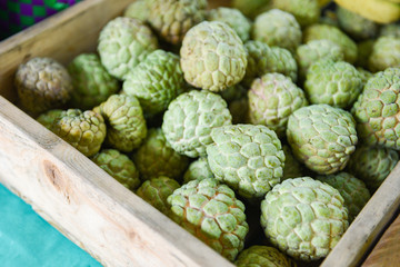 Sugar apple on wooden box in the fruit market Asian -  Annona sweetsop or or custard apple