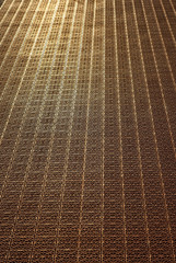 Obraz premium Red rubber coating for basketball and sports grounds. Texture of artificial floor close up.