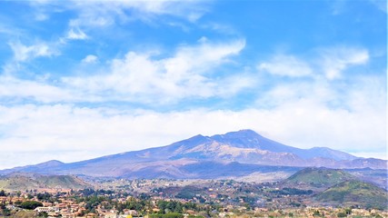 Fototapeta na wymiar March 5, 2019 Etna volcano calm on a sunny day, against a cloudy sky