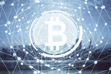 Double exposure of crypto currency theme hologram drawing and city veiw background. Concept of blockchain and bitcoin.