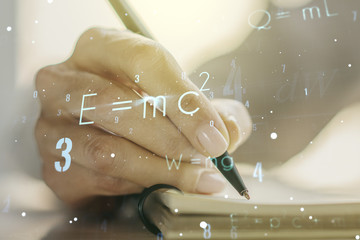 Creative scientific formula illustration with woman hand writing in diary on background, science and research concept. Multiexposure
