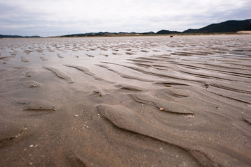 Waves texture small sand banks.