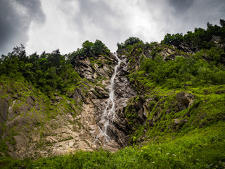 Charming scenery of waterfalls and picturesque meadows of Alps in National park Hohe Tauern near Kaprun, Austria, Europe.