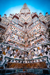 Fototapeta na wymiar Wat Arun temple Colourful tiles floral pattern Mosaic on Pagoda Landmark Architecture .