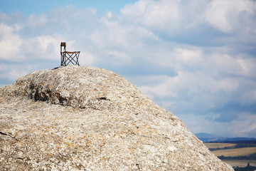 Adventure trip. Time to travel or summer holidays. Vacation time. Travelling concept. Tourist chair on top of mountain
