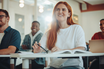 Girl studying in university classroom