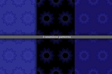 Set of abstract floral patterns. Seamless texture with blue flowers on blue and black background