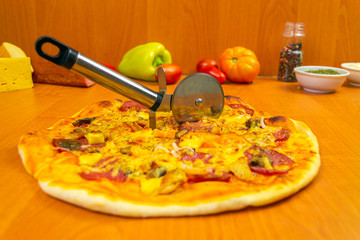 Pizza dough with tomato sauce on a rustic table