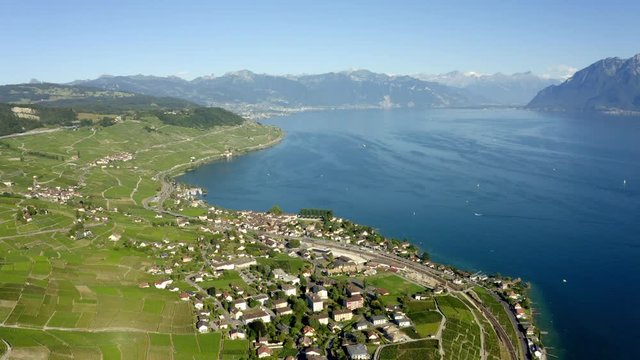 Beautiful Agricultural And Wild Landscape Of Lavaux -  Cully village and Lake Leman, Switzerland - Aerial Shot (pull back)