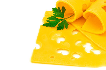 Rolled thin slices of hard yellow cheese with holes and parsley - 373458118