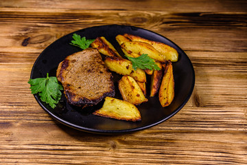 Roasted beefsteak with the fried potato and parsley