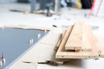 furniture, home and moving concept, installation and assembly of furniture in a new apartment