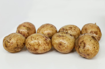 Boiled potatoes for cooking dinner with mushrooms, onions and parsley in a frying pan with oil