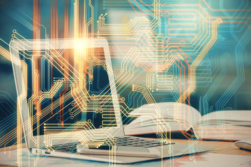 Double exposure of desktop with computer and world map hologram. International data network concept.