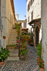 A small street between the old houses of Giuliano di Roma, of a medieval village in the Lazio region, Italy.