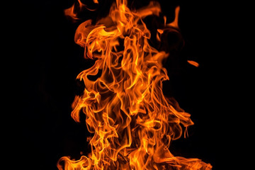 Fire flame isolated over black background, abstract texture
