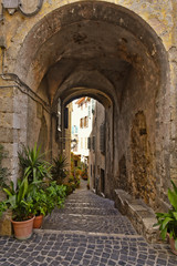 A small street between the old houses of Giuliano di Roma, of a medieval village in the Lazio region, Italy.
