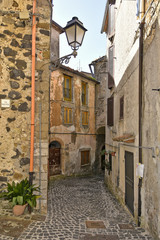 A small street between the old houses of Giuliano di Roma, of a medieval village in the Lazio region, Italy.
